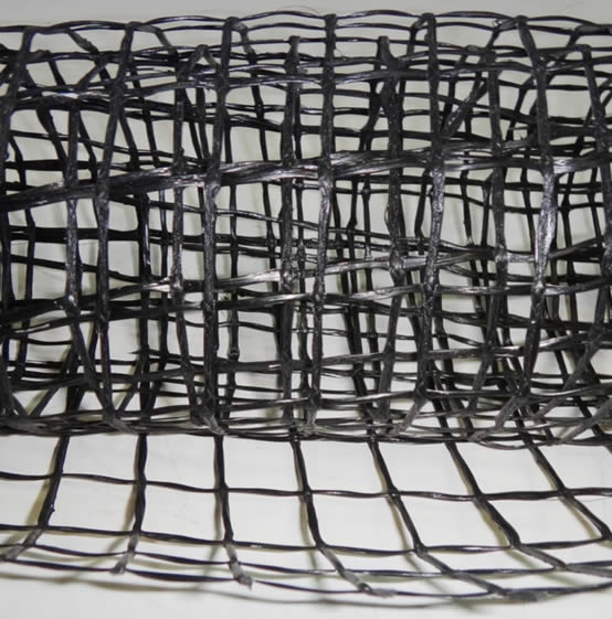 A piece of black fiberglass mesh for road construction
