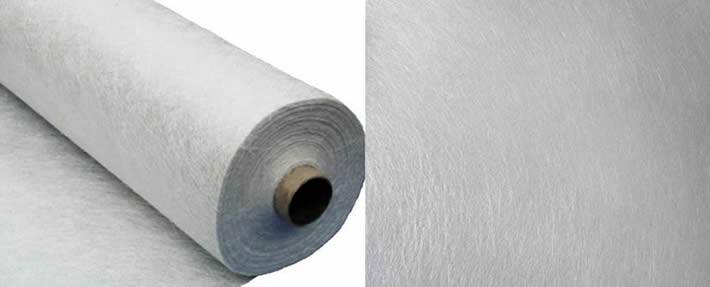 A roll of white non woven fiberglass fabric cloth