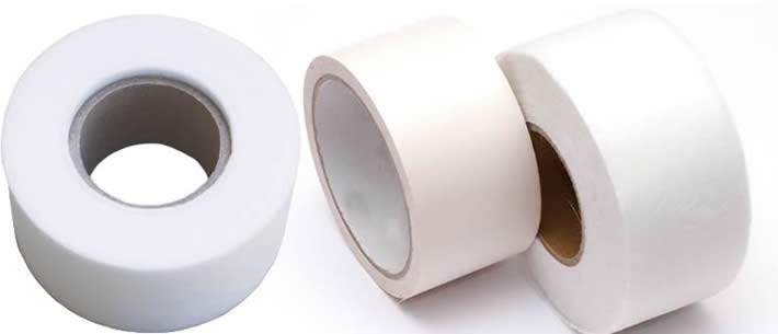 Three white non woven fiberglass tapes